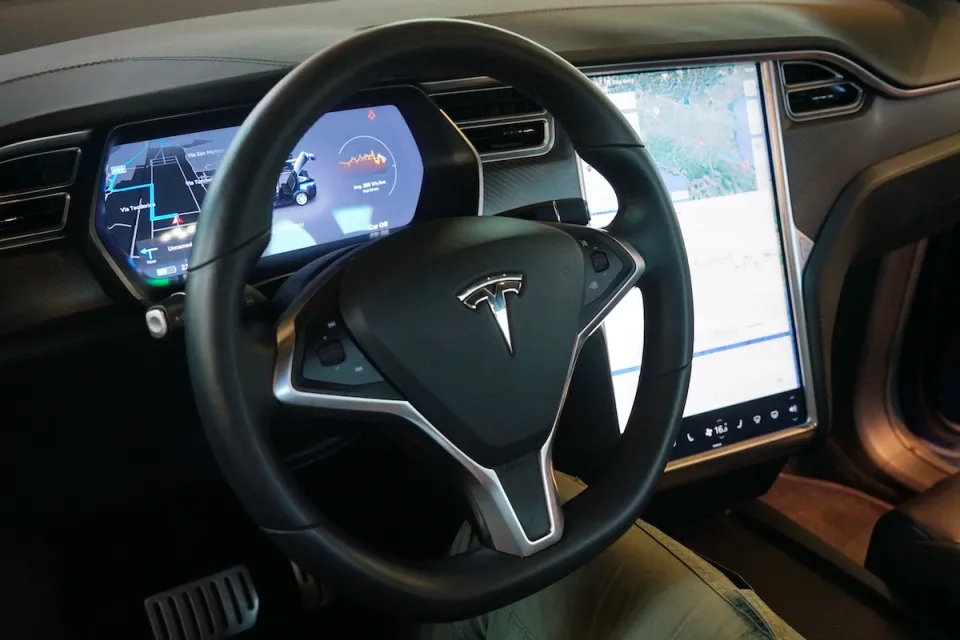 Interior of Tesla car with dashboard.